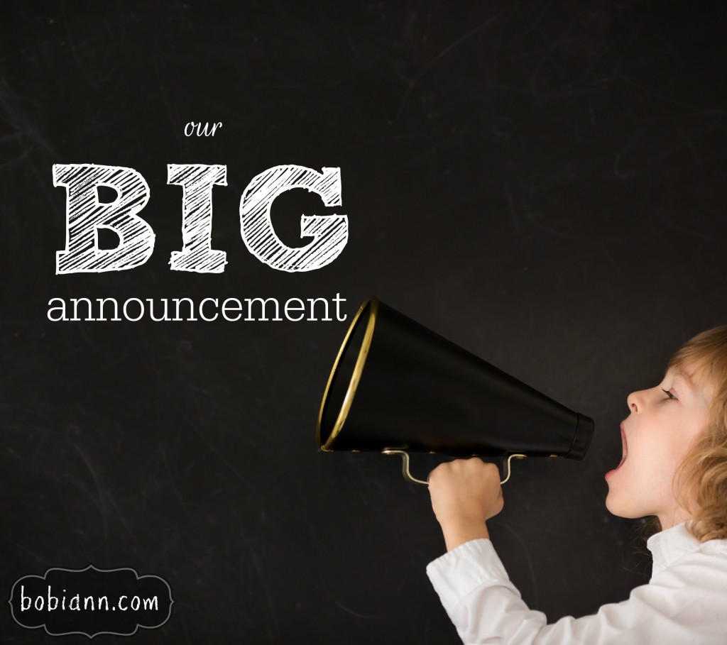 Kid shouting through vintage megaphone against blackboard